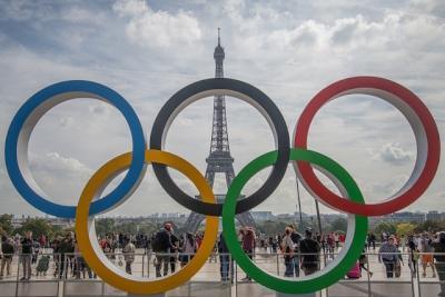 olympic rings in front of the Eiffel Tower